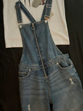 Blue denim overalls with adjustable crossed straps for women
