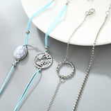 Ensemble de cinq bracelets perles rondes, perles craquelées turquoises, corde tressés carte, cercle creux métallique et à mailles argentés pour femme