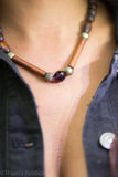 Noelya I jewelry.- Wooden bead and striated gold metal necklace