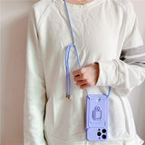 iPhone case with its strap across the shoulder, its card holder and its support ring for iPhone 14 to 8
