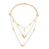Multi-chain necklace with moon, star, heart and pearl pendants - Gold color