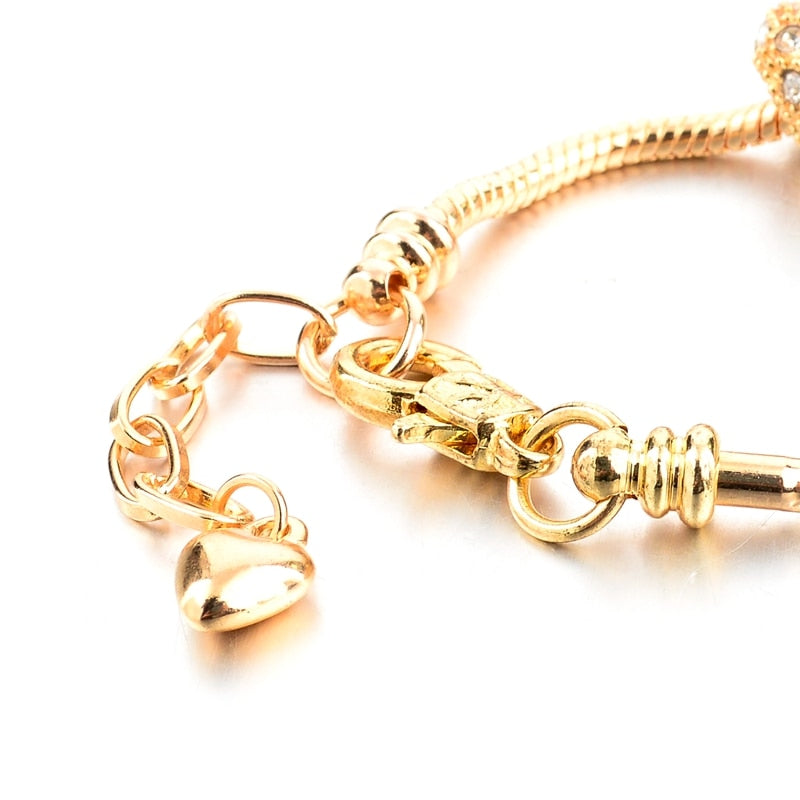 Gold-colored love charm bracelet for women with crystal heart