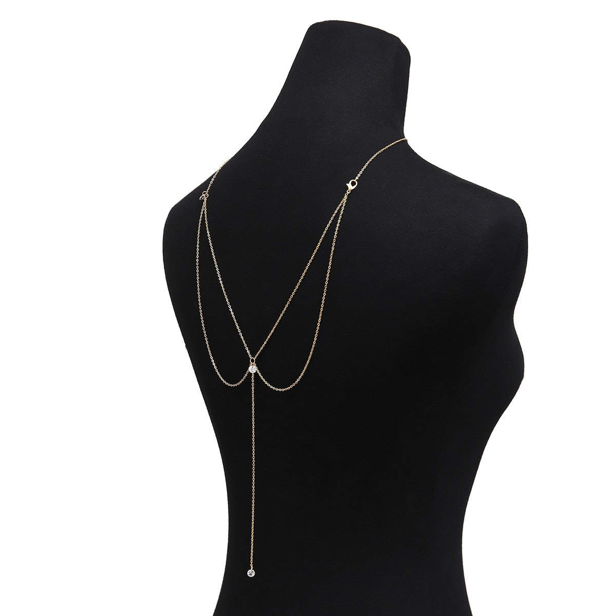 Long golden women's necklace with crystal pendant for back
