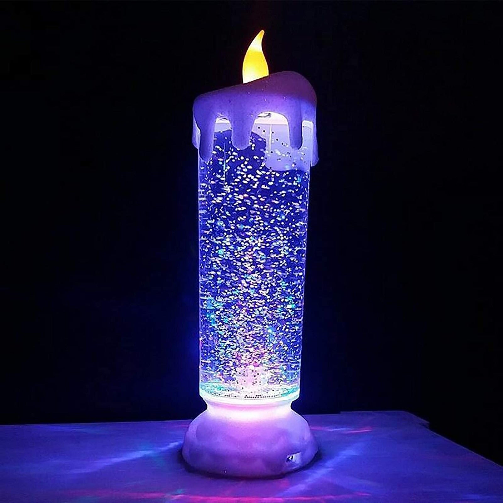 Lámpara de vela LED con agua y purpurina que cambia de color.